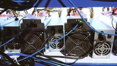 A large mining farm with rows of servers and advanced cooling systems